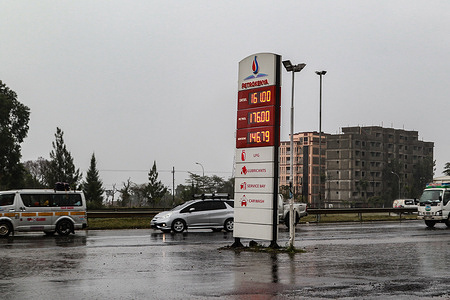 Vehicles are driven past a fuel price board on a busy highway in Nakuru Town.
In January 2023, the fuel price is expected to increase after the scrapping of the fuel subsidy scheme.