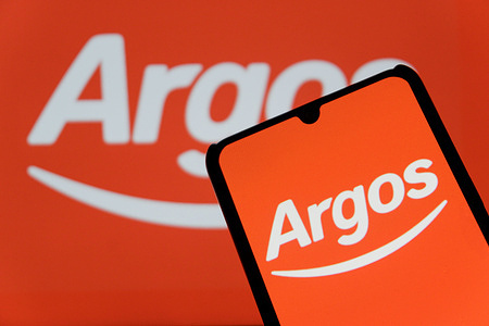 In this photo illustration, the Argos logo is displayed on a smartphone.