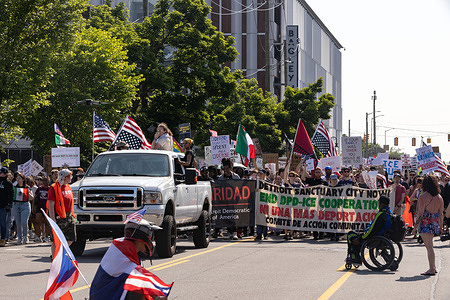 Protesters march from Clark Park to the U.S. Customs and Border Patrol field office at 477 Michigan Avenue to protest against President Donald J. Trump and his immigration policies. Americans took to the streets to protest Trump's military parade and the recent wave of Immigration and Customs Enforcement (ICE) raids that have become much more visible since Donald J. Trump started his second term as President. Participation in the "No Kings" protests included music, food, speeches, including U.S. Congressperson Rashida Tlaib and a march that began around 4pm from Clark Park to the ICE field office.