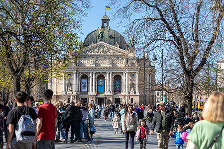 Crowds are seen walking in front of the Lviv National Opera House. Residents and visitors gather in the city center to maintain daily routines despite the ongoing war. The majestic Opera House remains the cultural heart of Lviv, rising above the bustling square as a symbol of immortal art and European spirit. The winged statues on its pediment, frozen against the clear sky, seem to guard the city as it continues to live and create despite the constant wailing of sirens. Even under the threat of drone and enemy missile attacks, this architectural brilliance embodies an unshakable faith in the triumph of beauty over destruction.