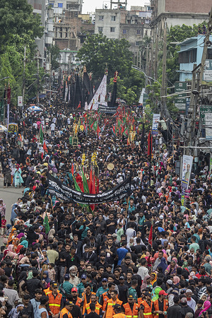 Bangladeshi Shia Muslims take part in a religious procession during the month of Muharram to mark Ashura. Ashura is the tenth day of Muharram, the first month of the Islamic calendar, observed around the world in remembrance of the martyrdom of Imam Hussain, the grandson of Prophet Muhammad.