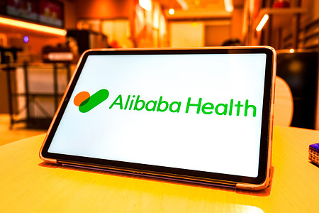 In this photo illustration, a logo of Alibaba Health Information Technology Limited is seen displayed on the screen of a smart tablet.
