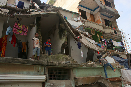 A couple of families are still living in a demolished building after the Bangladesh Inland Water Transport Authority (BIWTA) evacuation, These illegal structure are situated near the bank of Buriganga river.
Around 145.1 acres of land have been reclaimed along the Buriganga rivers surrounding Dhaka while demolishing 5,239 illegal establishments from January to June this year.