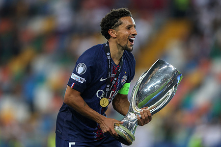 Marquinhos (Marcos Aoas Correa) of Paris Saint-Germain holds the trophy during the ceremony after the UEFA Super Cup 2025 between Paris Saint-Germain and Tottenham Hotspur at Stadio Friuli. Final score: Paris Saint-Germain 2:2 (penalty 4:3) Tottenham Hotspur.