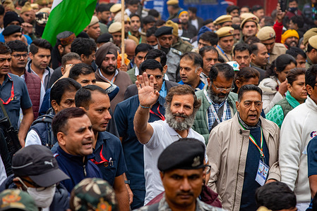 Congress Leader Rahul Gandhi (C), in a white shirt, waves at his supporters during the Bharat Jodo Yatra, an ongoing mass movement organized by Indian National Congress (a political party in India). Rahul Gandhi, leader of India's major political party, marched in the national capital with his supporters as part of his five-month-long 3,570km (2,218-mile) countrywide trek through 12 states from Kanyakumari in Southern India to Kashmir in North India.