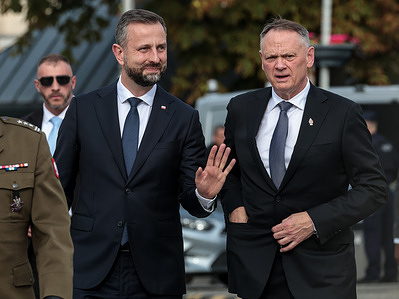 Deputy Prime Minister and Minister of Defence of Poland Wladyslaw Kosiniak-Kamysz (L) welcomes Minister of Foreign Affairs of Canada David McGuinty (R). The politicians signed Memorandum of Understanding of bilateral defence cooperation between Canada and Poland.