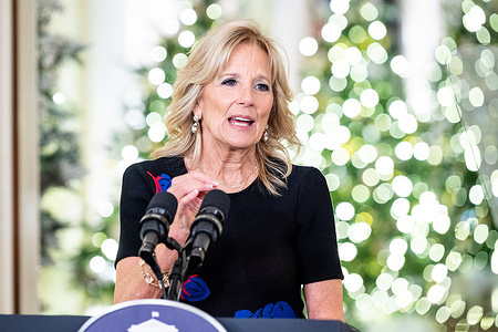 First Lady Jill Biden in the East Room of the White House delivering a holiday message of "unity and hope" and thanking the volunteers who helped decorate the White House for the holidays.
