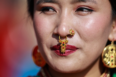 A woman in traditional attire dances and sings during Sonam Lhosar celebrations, marking the Tamang New Year and the beginning of the Year of the Horse.