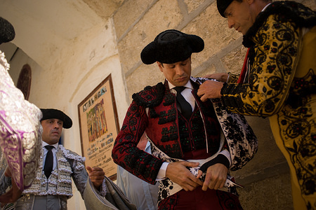 A Spanish bullfighter Jose Maria Manzanares is helped by his assistants before to start the bullfight at La Malagueta bullring in Malaga.
Bullfighting is a traditional performance mostly practiced in Spain. In most part of Spain it is still legal although animal right activists constantly protest against it.