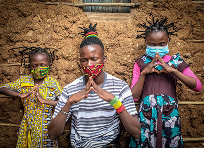 12 year old, Martha Apisa and her close neighbour 8 year old, Stacy Ayuma with an elder are seen using their hair style braids to create awareness and sensation about the Corona Virus during the pandemic.Daily life in Kibera slums the largest in Nairobi, has not been greatly affected by the ongoing covid19 pandemic except for a few activities limited by the imposed curfew due to the pandemic.