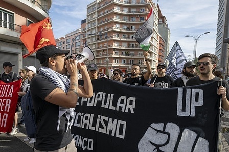A protester chants slogans on a megaphone during the rally. The protest was part of the campaign “All for Palestine. End the genocide! End the occupation!” organized by different social action groups based in the Portuguese capital.