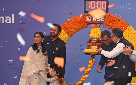 Isha Ambani, Anand Piramal, Executive Chairman Piramal Finance Limited and their son Krishna Piramal (L) seen after ringing the bell announcing the listing of Piramal Finance Limited Initial Public Offer (IPO) at the National Stock Exchange (NSE).