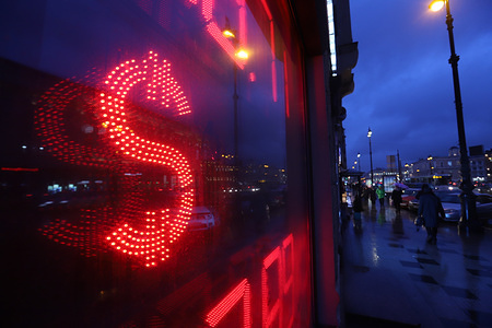 US dollar sign on an information board displaying currency exchange rates.
Euro and US dollar continue to grow as oil prices fall down. Brent Crude oil lost 10 percent 18th of March and costs less than 25 US dollars first time since 2003.