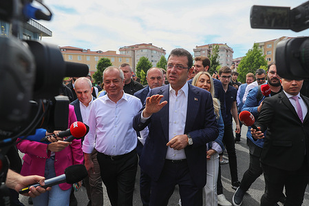 Istanbul mayor Ekrem Imamoglu arrives to cast his vote at a polling station during the general election.