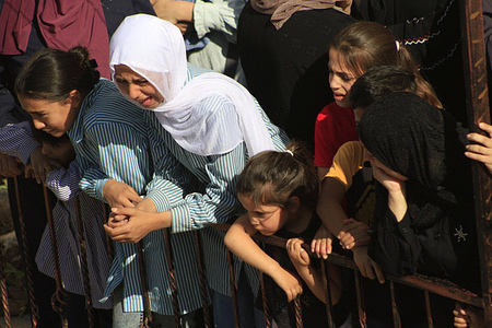 Relatives cry as mourners carry the body of Palestinian Rawhi Sawafta, 70, who was killed by Israeli forces’ bullets during their storming on the city of Tubas in the northern West Bank.