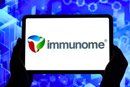 In this photo illustration, the Immunome logo is seen displayed on the screen of a tablet.