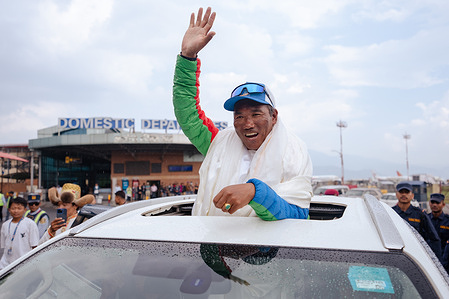 Legendary Mountaineer Kami Rita Sherpa waves at people as he arrives after scaling Mt Everest for the 30th time, leading the world record of most ascents on the world's highest peak Mount Everest at Tribhuvan International Airport. Kami Rita Sherpa, considered one of the greatest mountain guides, reached the 8,849-meter (29,032-foot) summit at 7:49 AM local time on Wednesday 22 May, 2024 according to expedition organizer Seven Summits Treks.