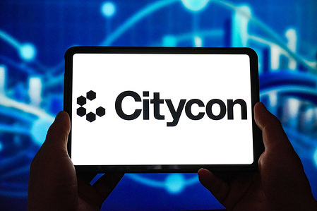 In this photo illustration, the Citycon logo is displayed on the screen of a smart tablet.