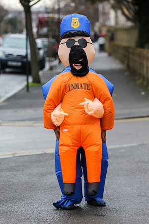 An Orthodox Jewish child dressed as a police officer and a prisoner seen as Jews celebrate Purim festival on the streets of Stamford Hill in north London. Purim festival is celebrated by Jewish community around the world, commemorating when Jewish people were saved from Haman.