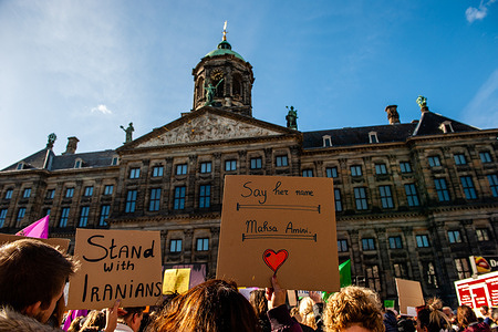 Hundreds of people are seen gathering while holding placards in support of Iranian women during the demonstration. Because today marks a month since the death in custody of Mahsa Amini, who was detained by the morality police for allegedly wearing her headscarf too loosely, the Kurdish, Iranian and Afghan diasporas called for a rally in the city center to protest against the Islamic Regime and the general oppression of women. Inside Iran, protests keep continuing, despite a brutal crackdown by authorities that Iranians for Justice and Human Rights activists claim have taken more than 200 lives.