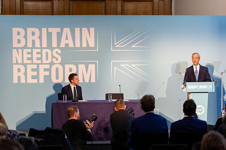 Shadow Chancellor of the Exchequer, Robert Jenrick (R) speaks during the party press conference.