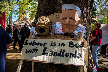 A wooden sculpture is displayed during the National Housing demonstration. Activists rallied to call for rent controls as well as more, and better, council housing.