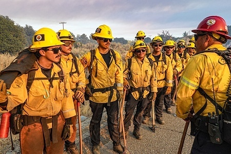 Firefighters respond to the wildfire. The Thorn Fire burns near Buckthorn Trail and Clover Trail in the Boulevard/Campo area of southeastern San Diego County on Wednesday, July 15, 2026. Fueled by hot, dry conditions, the wildfire spreads rapidly, prompts evacuation orders and warnings, temporarily closes portions of Interstate 8, and draws a large response from Cal Fire and local agencies. Firefighters on the ground, supported by air tankers and helicopters, work to slow the fire's advance and protect nearby homes and infrastructure as officials monitor changing fire conditions.