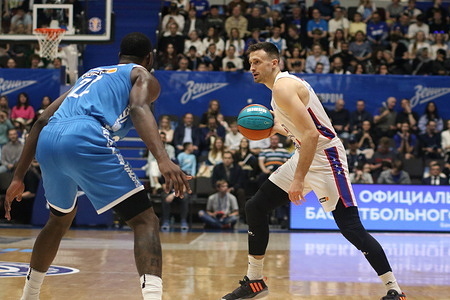 Alex Poythress (22) of Zenit and Aleksa Avramovic (4) of CSKA in action during the VTB United League basketball match, Playoffs, finals, 2 match, between Zenit Saint Petersburg and CSKA Moscow at "kck Arena". Final score; Zenit 86:70 CSKA.