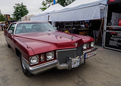 1963 Cadillac Deville, the Cadillac DeVille is a model name used by Cadillac for eight generations. It was originally used to designate the trim level of the 1949 Cadillac Series 62 and later to designate a distinct model in the brand's lineup. A traditional exhibition of American classic cars and motorbikes is held at the Pullman City entertainment complex in Eging am See, Germany. Car enthusiasts from Germany, Austria, and Switzerland traditionally take part in this show.