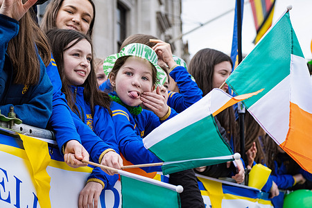Young performers participate during the St Patrick's Day Parade. London's Irish community celebrated St Patrick's Day Festival with a parade in Central London, with performance by marching bands, sports clubs and Irish dancing schools. More than 50,000 people were expected to participate in the party and to admire Irish dancing, food and music.