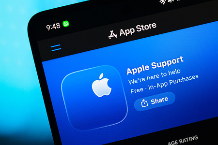 In this photo illustration, the Apple Support logo is seen displayed on a smartphone screen in the Apple app store.