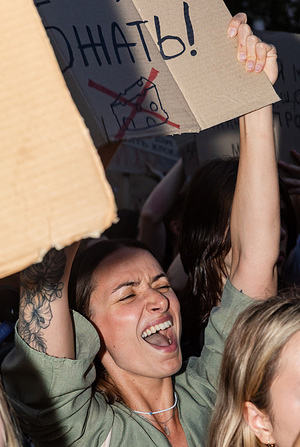 A woman seen shouting while holding a cardboard sign featuring a crossed-out cheese illustration and the Russian word for hold, protesting the dismissal of Defense Minister Mykhailo Fedorov. For the fifth consecutive day, Ukrainians took to the streets to protest against the dismissal of former Defense Minister Mykhailo Fedorov and to demand the resignation of Armed Forces Commander-in-Chief Oleksandr Syrskyi. People gathered in many cities. The demands of the protesters remain unchanged: to reinstate Fedorov as Defense Minister and to dismiss Commander-in-Chief Syrskyi.