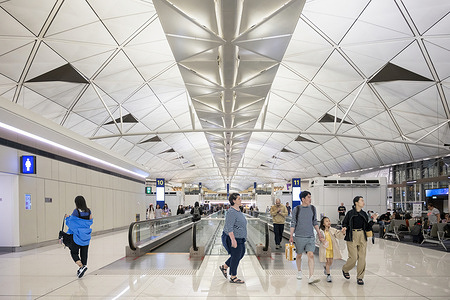 Flight passengers are seen at the departure hall at Chek Lap Kok International Airport.