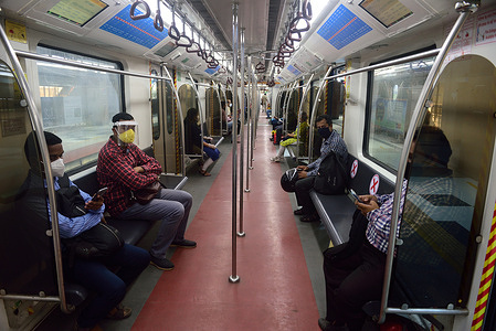Commuters wearing face masks inside the Metro rake (train) as a preventive measure against the spread of Coronavirus (COVID-19).
Kolkata Metro started operating again after the services were stopped because of the Covid-19 pandemic on March 23. However, the coaches were mostly empty in the first few hours.