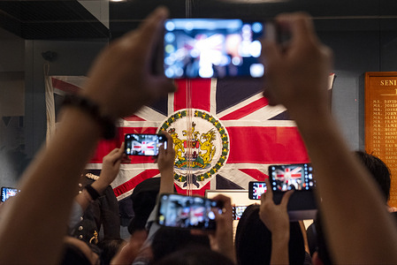 Visitors take photographs of a colonial British Hong Kong flag at the Hong Kong museum of History. The permanent exhibition of the museum will close on 19 October 2020 for a major renovation for the next coming year creating a public concern whether the exhibitions and facts will remain untouched once it reopens.