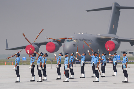 Indian Air Force (IAF) personnel perform rifle handling skills during the 93rd Air Force Day parade at Hindon Air Force Station in Ghaziabad. Heritage Flight aerials and combat demonstrations thrilled the audience, as families, veterans, and civilians celebrated courage, precision, and pride.
