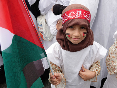 A girl holds a Palestinian flag during a rally in solidarity with Palestine at Station Square in Diyarbakir. Tens of thousands of individuals gathered at Station Square to show their support for Palestine and the Hamas Movement during a rally organized by the Kurdish Islamic Party Free Cause Party (HUDA-PAR). During the speeches, the event highlighted that "Israel has committed a crime against humanity, and States that do not interfere in it are partners of this crime." On October 7, the Palestinian militant group Hamas initiated an attack on Israel, which led to Israel's retaliation with an attack in Gaza.