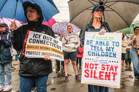 Migrant community supporters hold signs and placards expressing their opinions near the superior court to protest against I.C.E. raid operations. A press briefing and protest were held against local (Immigration and Customs Enforcement) I.C.E. raids that resulted in the detention of multiple migrant individuals. The individuals were detained on their way to work.
