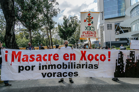 Protesters carry a banner during a demonstration against Mitikah. Inhabitants of the Town of Xoco and groups of native peoples of Mexico City held a protest this afternoon in avenues and streets surrounding the Mitikah shopping center near the Benito Juarez mayor's office claiming the problems that the construction has caused to their lives as the lack of mitigation actions for water supply, pollution and the elimination of their traditions.