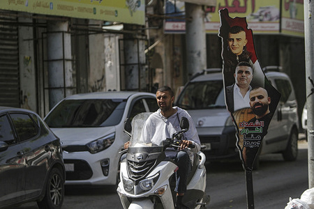 A portrait of three Palestinians Ata Shalabi, Soudqi zakarneh and Tarek who were shot dead by the Israeli army a month ago hangs on the sidewalk along the street, in the western part of Jenin, in the northern occupied West Bank. Early morning the Israeli army forces killed two Palestinians during an armed clash in the Palestinian town of Qabatiya.