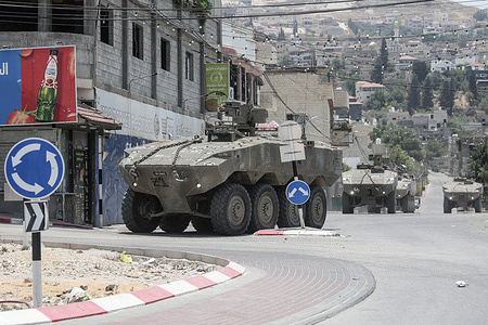 Israeli Eitan armored vehicles storm the town of Jaba near the West Bank city during a military operation. Israeli forces searched homes and neighbourhoods for weapons and they launched a large-scale arrest campaign, including raids and house searches. They arrested a number of Palestinians during the military operation.