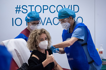 A health worker wearing a face mask gets vaccinated at Civico Hospital.
“Civico” Hospital in Palermo Kicks-off Sicily’s Covid-19 Vaccination Campaign. After the Italian Army’s delivery of the Pfizer-BioNTech COVID-19 Vaccine to Doctor Francesco Gervasi, who stored it in the Oncology Department, a first group of medical and health workers at risk had been vaccinated in the morning."
