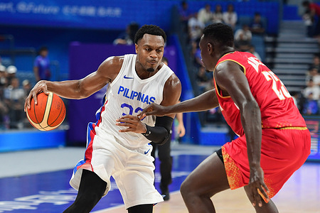 Justin Brownlee (L) of the Philippine men basketball team seen in action during the 19th Asian Games 2023 Men's Basketball Preliminary Round Group C match between Philippines and Bahrain at the Hangzhou Olympic Sports Centre Gymnasium. Final score; Philippines 89:61 Bahrain.