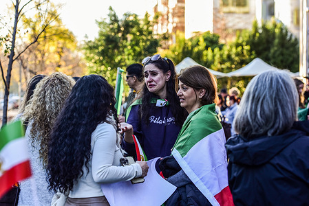 Iranian women with national flags are seen during the protest. MELIRAN is Melbourne based political organization that supports exiled Iranian Crown Prince Reza Pahlavi and opposes the Islamic Republic of Iran. The group staged a protest to oppose the U.S. agreement with the Iranian government.