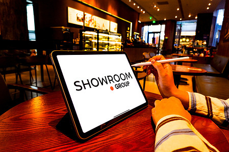 In this photo illustration, a SRP Groupe (Showroomprive.com) logo is displayed on the screen of an iPad.
