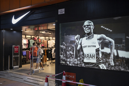 American multinational sports clothing brand Nike store displaying an image of British Olympic Champion athlete Mo Farah in Hong Kong.