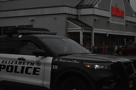 Elizabeth police block entry to the parking lot of the Wawa. Early Saturday morning around 5:00 AM, police responded to a report of a shooting at Wawa in Elizabeth, located at 595 Spring Street. An individual was suffering from gunshot wounds and was taken to the hospital for treatment. At this time, there is no indication that the shooting is fatal. Wawa was closed while police conduct the investigation. Police tape littered the sidewalks and public areas for processing of the scene by investigators.