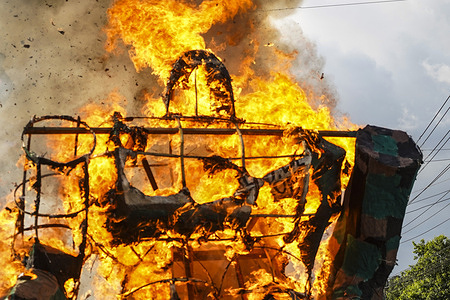 An effigy is set on fire during a demonstration commemorating the 47th anniversary of a massacre of university students by the military on July 30, 1975 and the ongoing state of emergency ordered by the Salvadoran Congress.