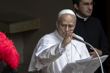 Pope Leon XIV delivers his Angelus prayer from Castel Gandolfo, where he is spending his summer holidays, flanked by his personal secretary, Father Edgard Iván Rimaycuna Inga.