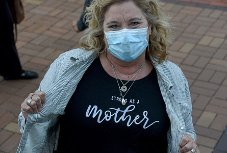 A vigil attendee displays her "Strong as a Mother" shirt in honor of late Supreme Court Justice Ruth Bader Ginsburg, who died two days ago.
Mourners gathered at the Old Dayton Courthouse to reflect on Justice Ginsburg's life and contributions.